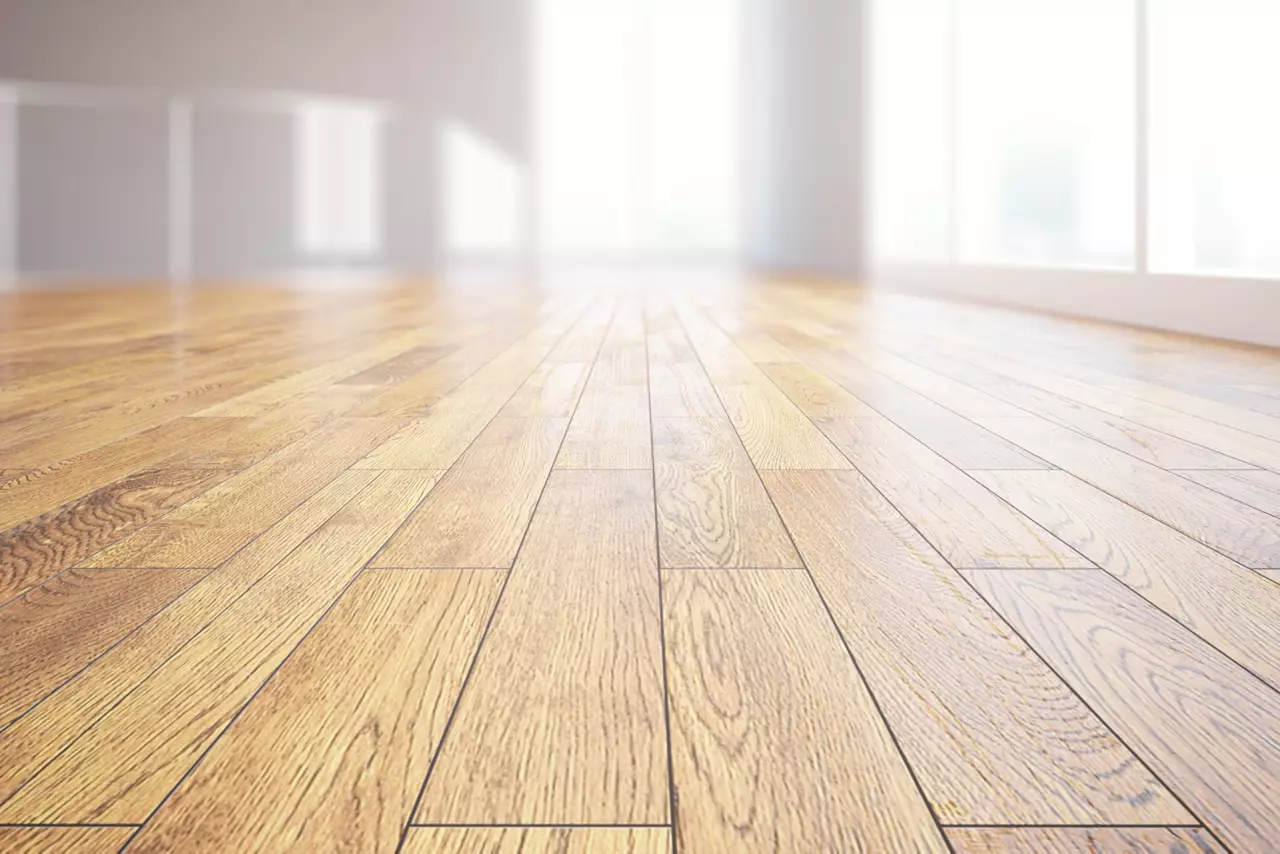 Closeup of light wooden floor in bright room interior