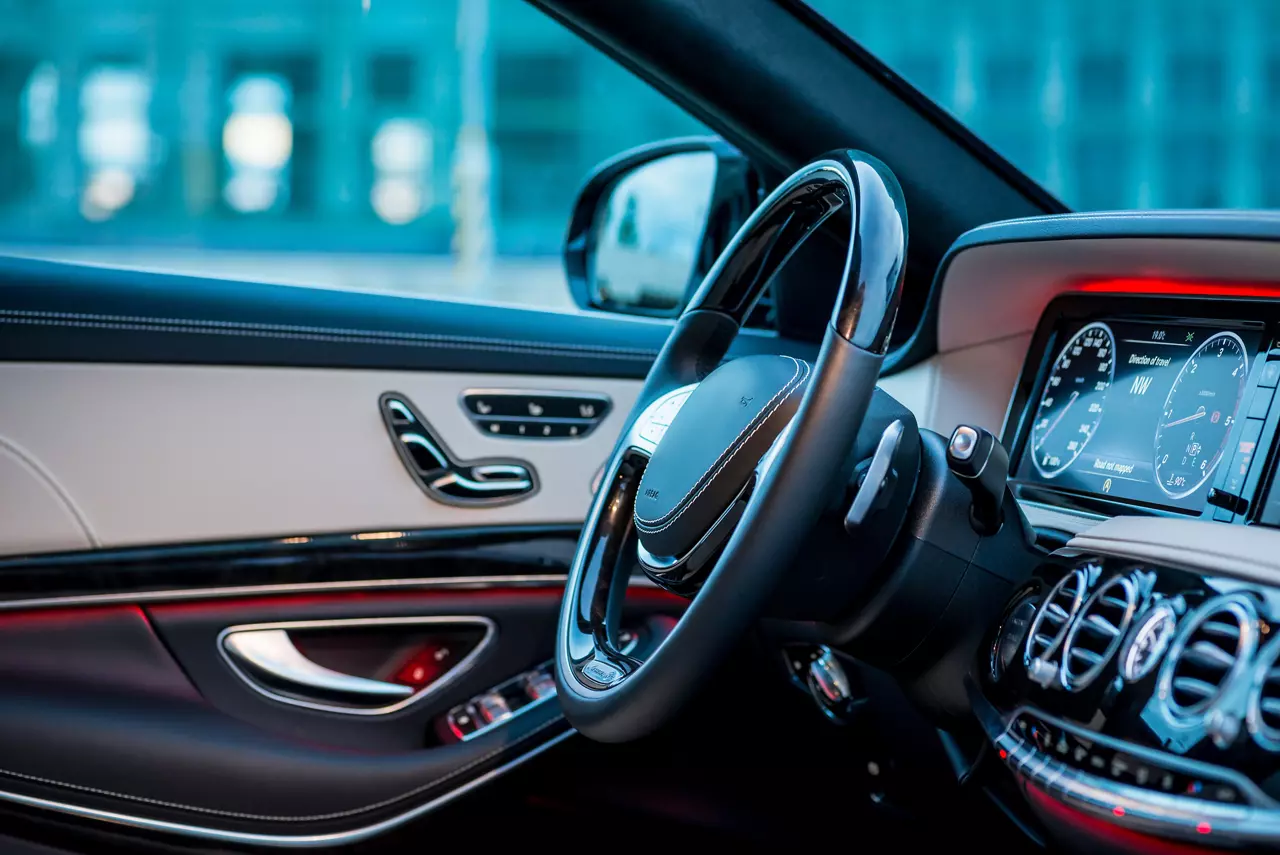 Luxury car steering wheel and dashboard on the driver’s side