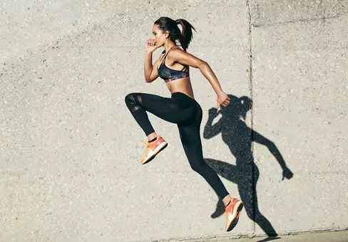 Fit woman exercising outdoors. 