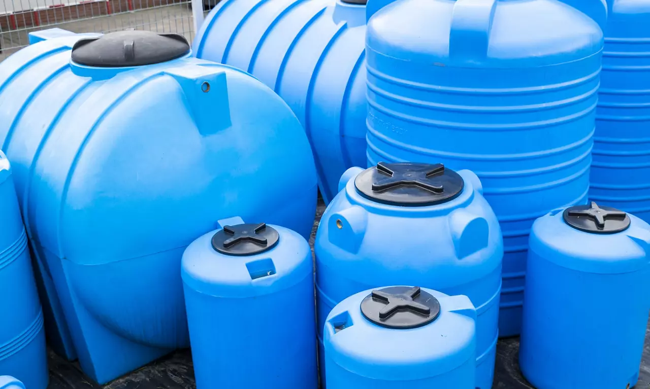 blue plastic barrels for drinking water, liquid storage tanks 
