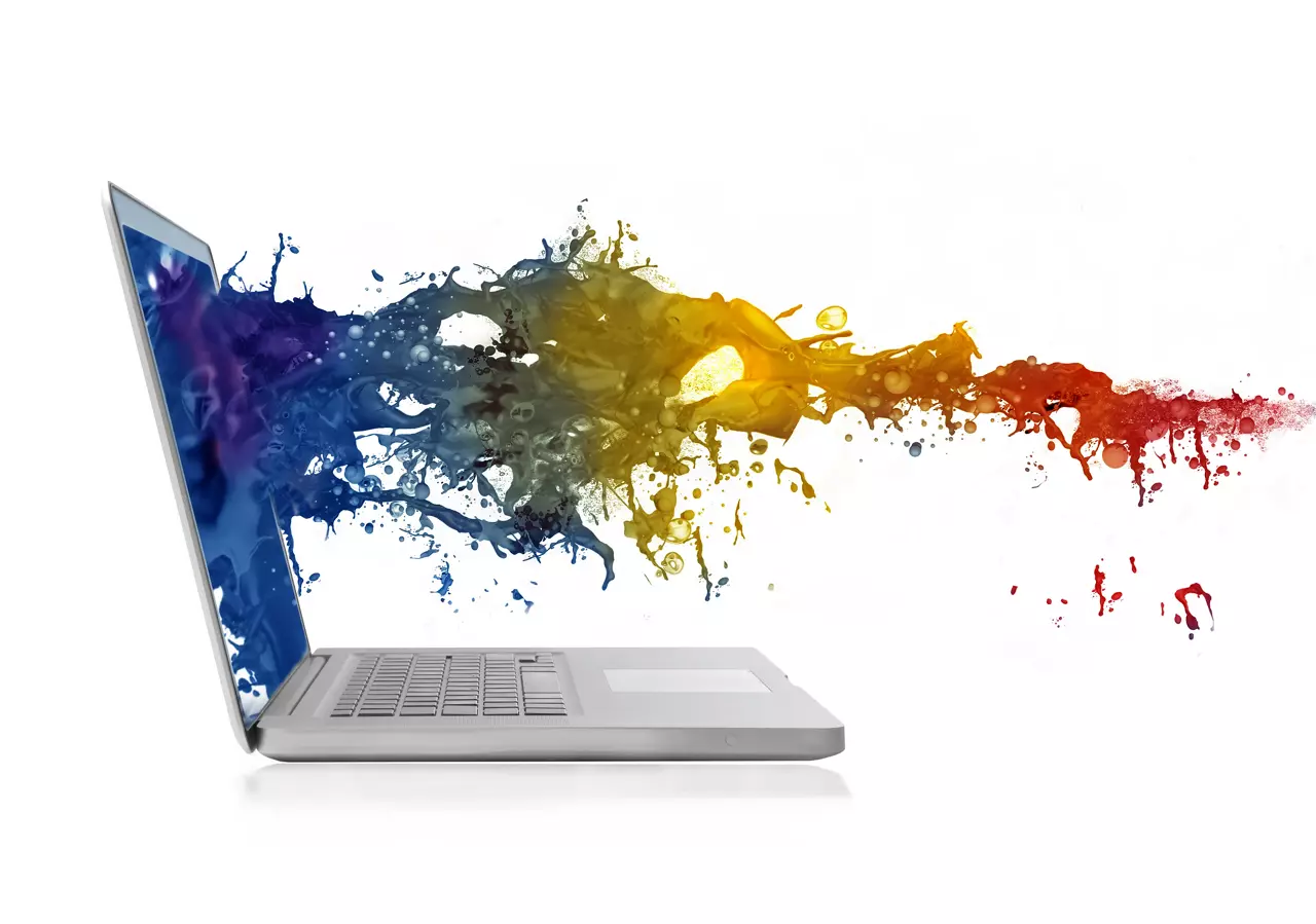 Computer screen exploding with colorful liquid coming out of it.