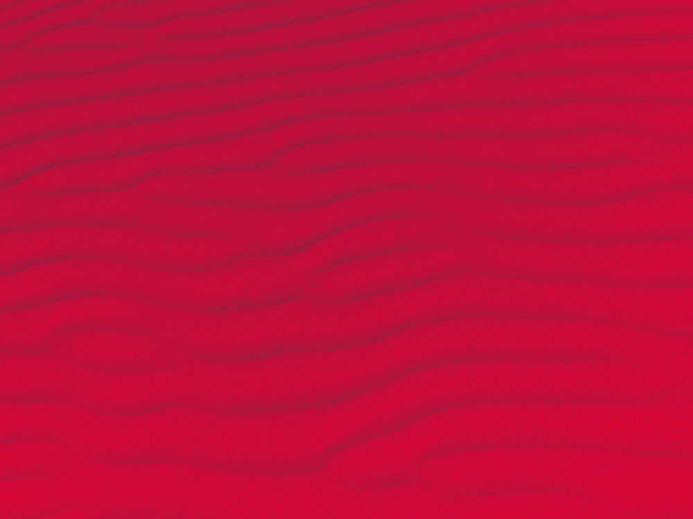 Sand texture.Dented wave of the blow of the wind - red texture