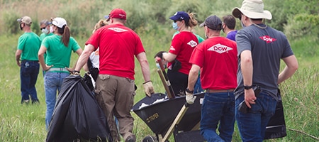 Dow volunteers in a field