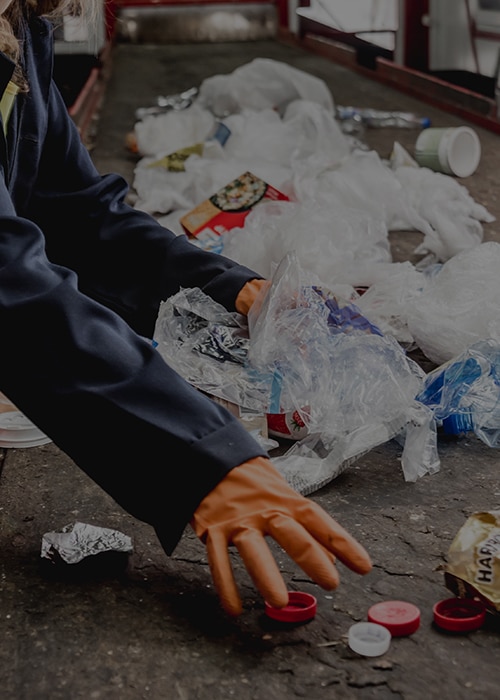 At modern recycling plant. Separate garbage collection. Workers
At modern recycling plant. Separate garbage collection. Workers sorting trash to be processed. Trash sorting.