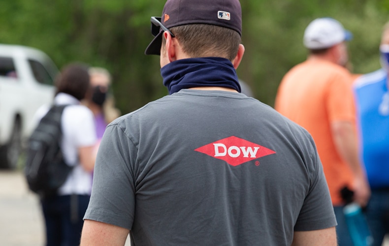 Dow team members pack food items for distribution