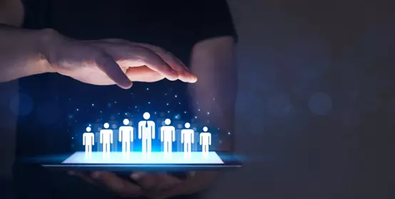 Businessman holding tablet and management group of people corporate team. Leader and his team of workers for a successful business.