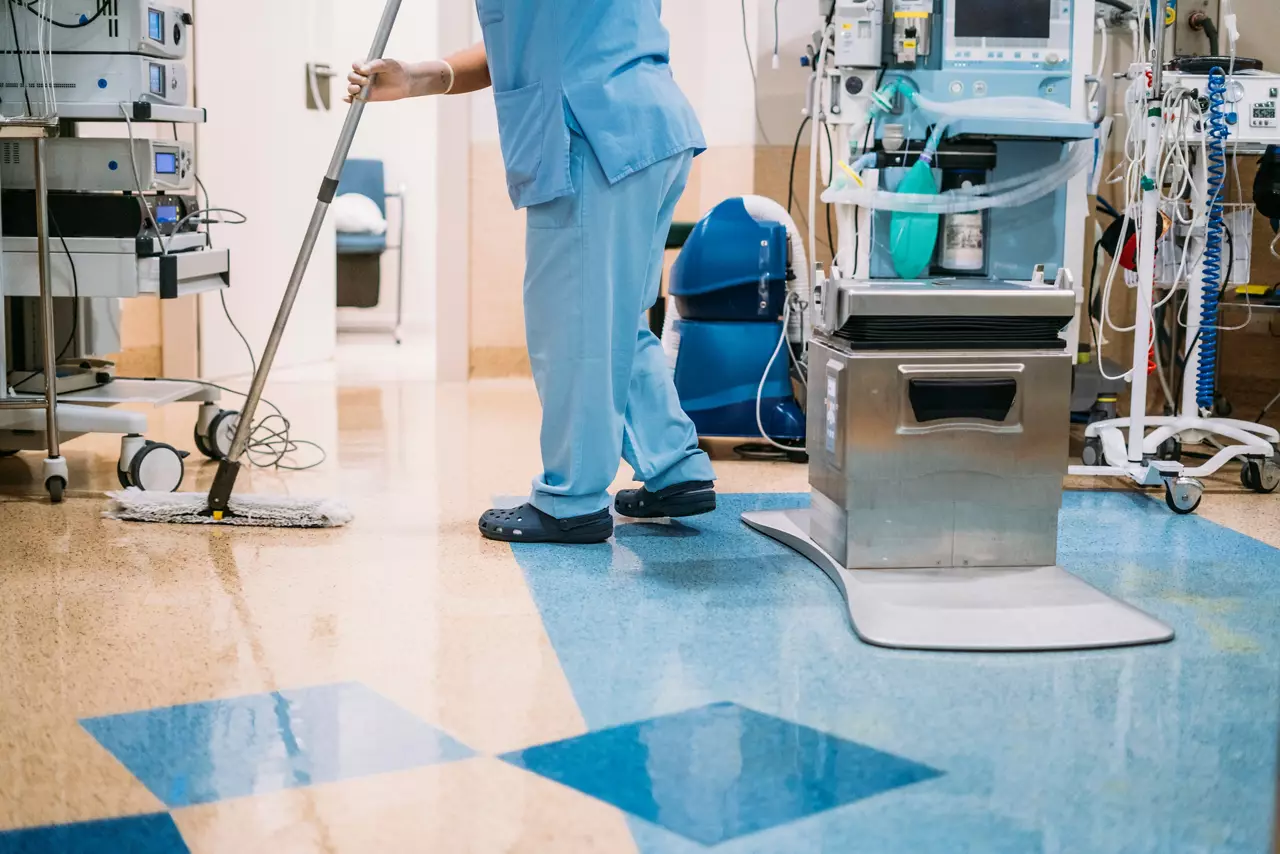 Person cleaning surfaces in hospital