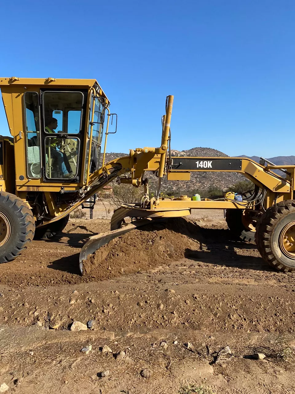 Soil stabilization process with road being built. 